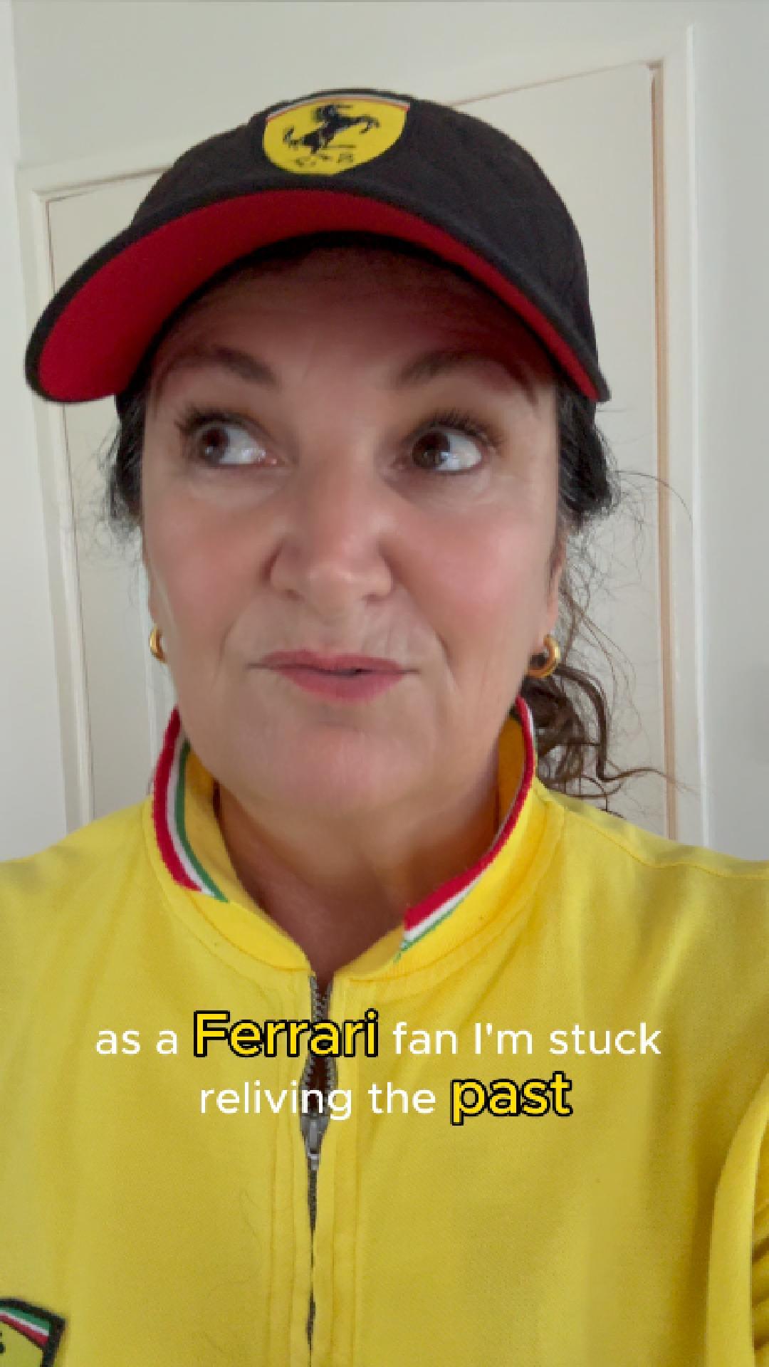 Travelletto in yellow Ferrari top and black Ferrari cap