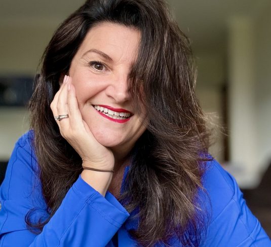 Dianne Bortoletto smiling in blue top